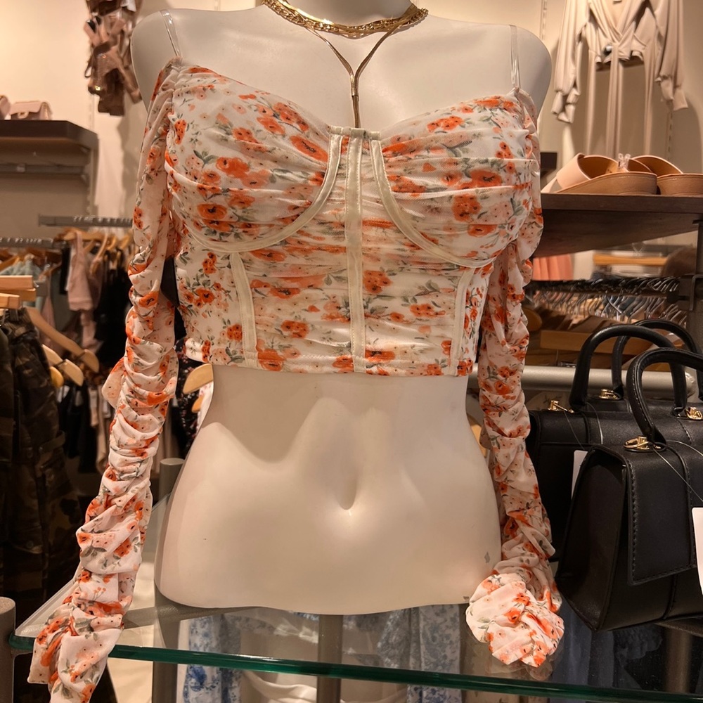 cropped floral long sleeve top.